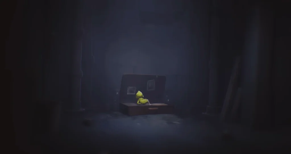 Six from Little Nightmares sits in suitcase room