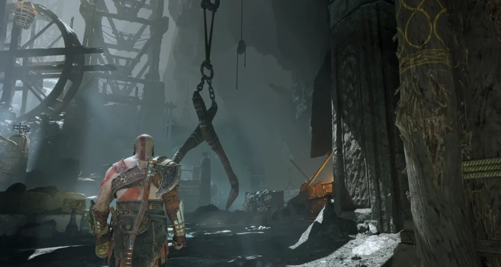Kratos walks through foggy mine in God of War
