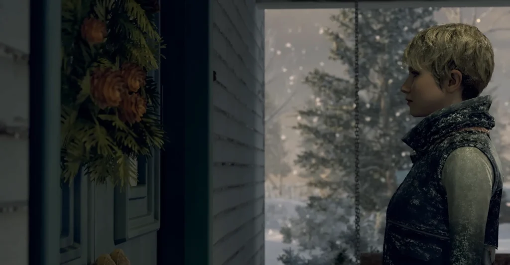 Woman stands on porch during snowfall near wreath