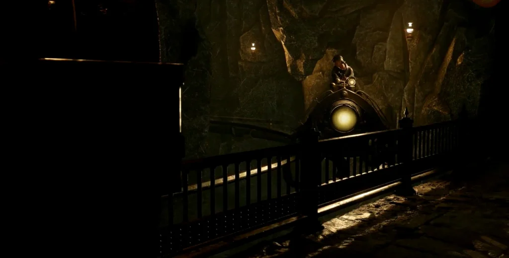 Mine cart approaching tunnel inside rocky cave