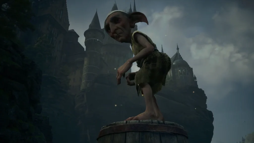 House-elf stands on barrel outside Hogwarts castle at dusk