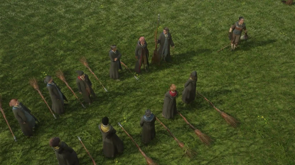 Hogwarts Legacy students standing with brooms on grassy field