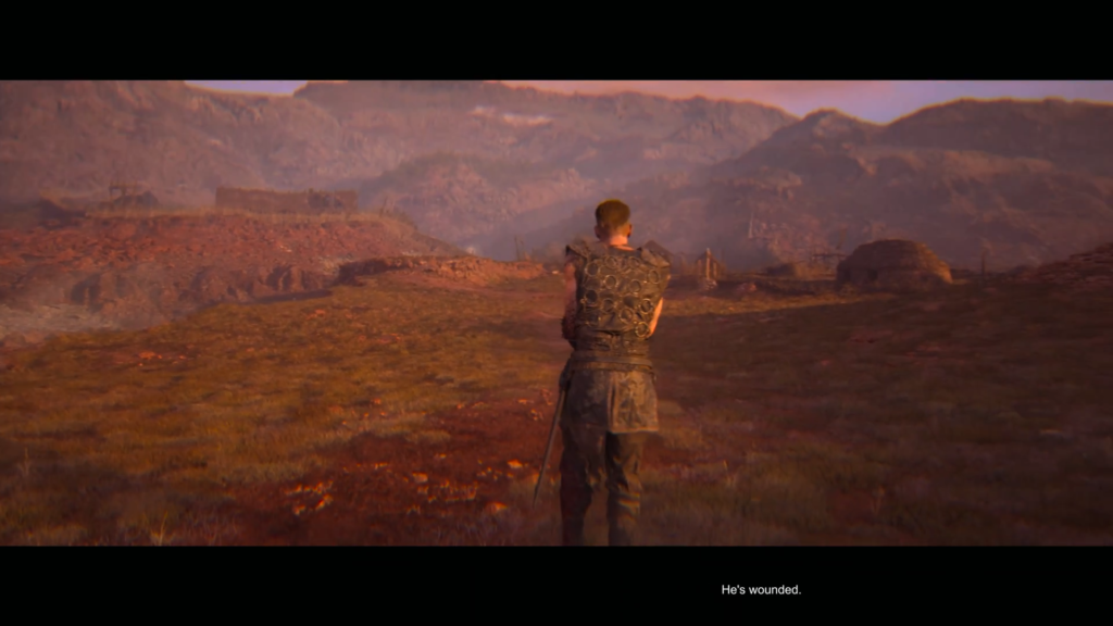 Armored warrior stands in grassy valley facing mountains