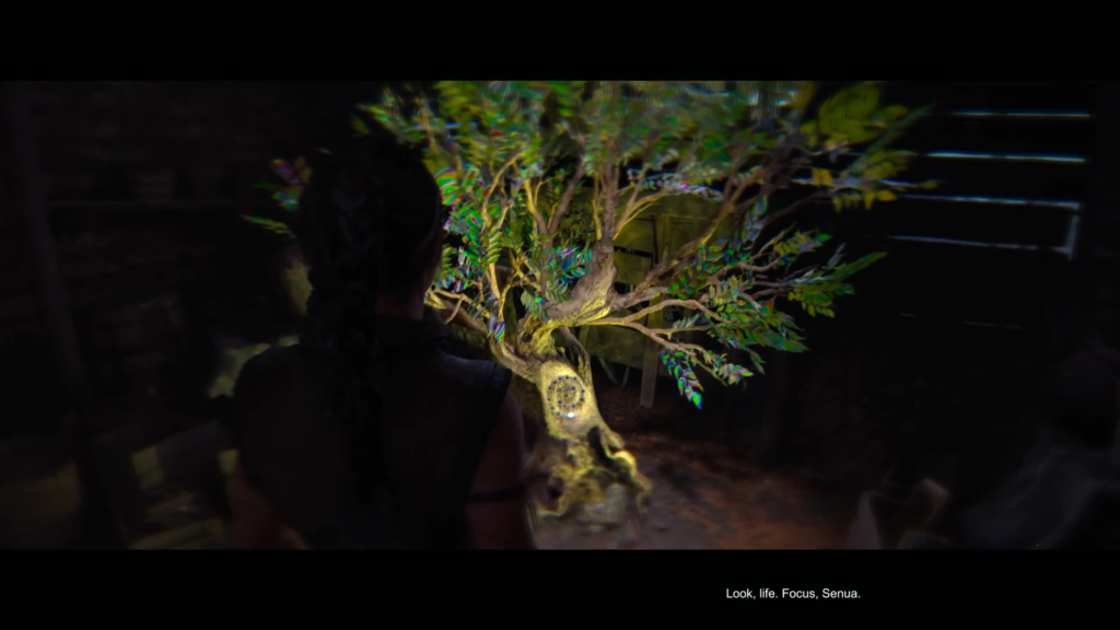 Senua looks at glowing tree in Hellblade: Senua's Sacrifice