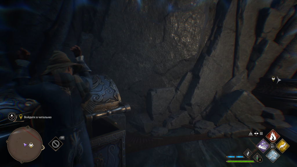 Wizard opening ornate chest in rocky cave