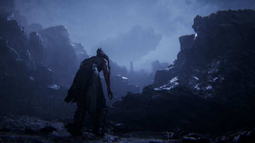 Warrior walks through rocky canyon in blue mist