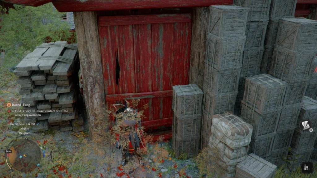 Player character hides by red barn and crates
