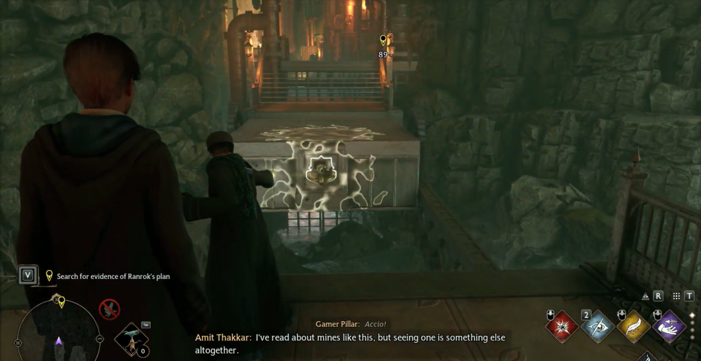 Hogwarts Legacy wizard casts Accio in rocky mine