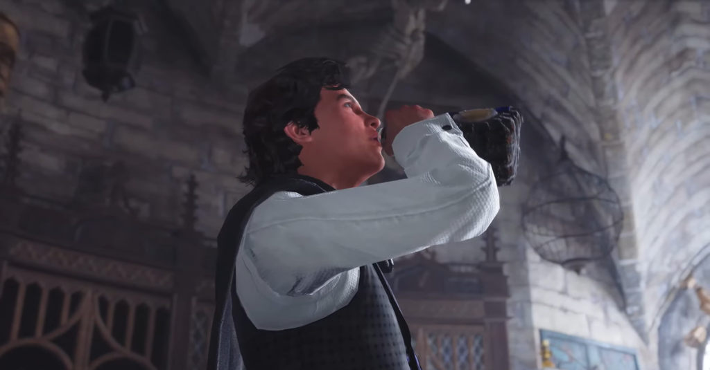 Man drinks from bottle inside stone hall