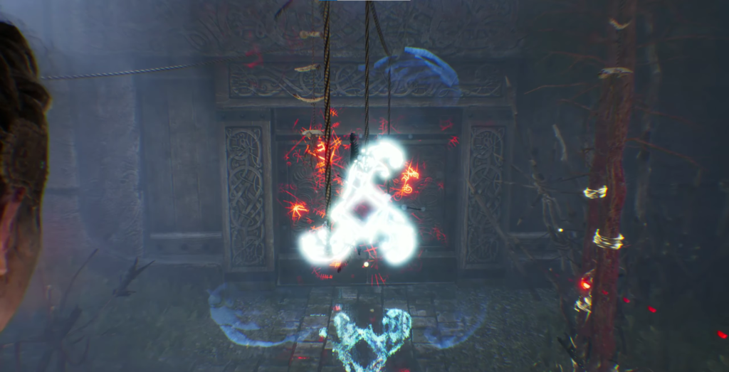 Glowing rune floats before carved stone door in ruins