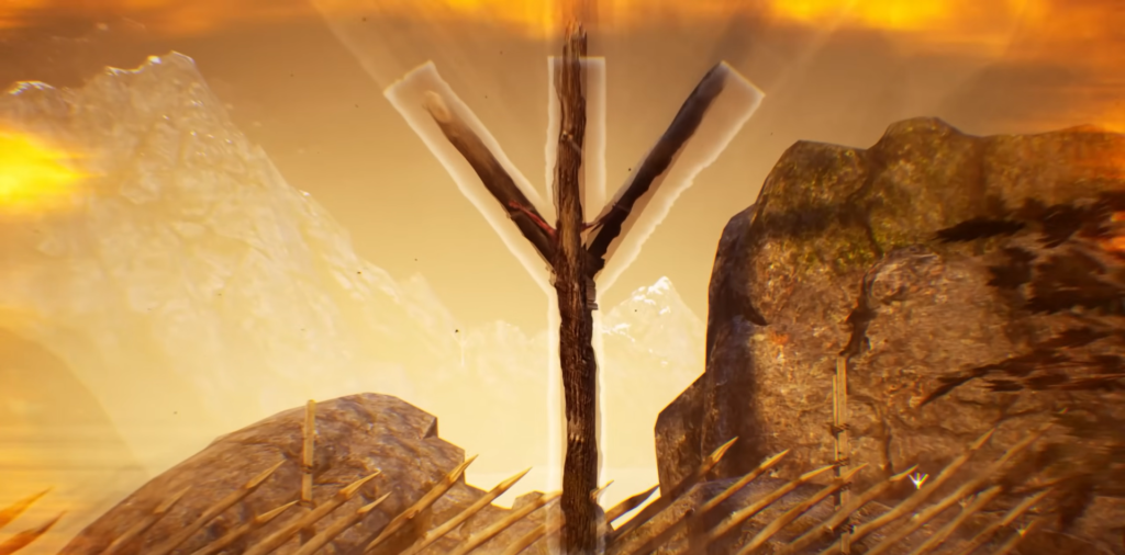 Wooden Y-shaped post standing among rocks at sunset