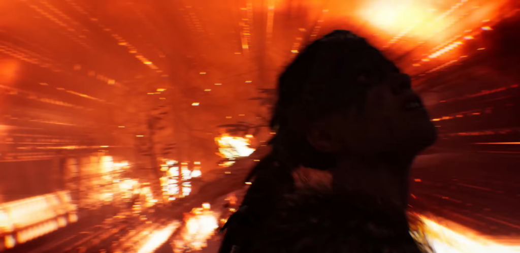 Silhouetted person recoils amid orange explosion indoors