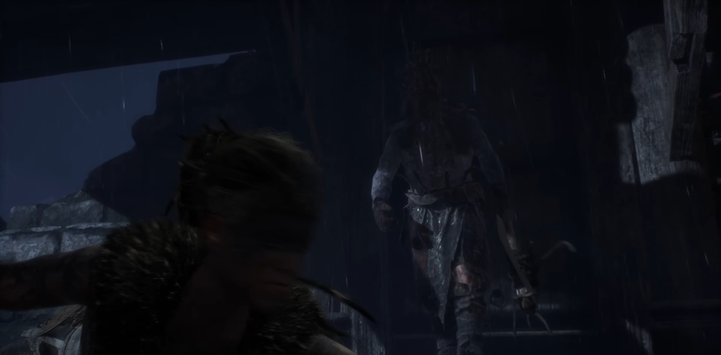 Person running in rain near stone ruins at night