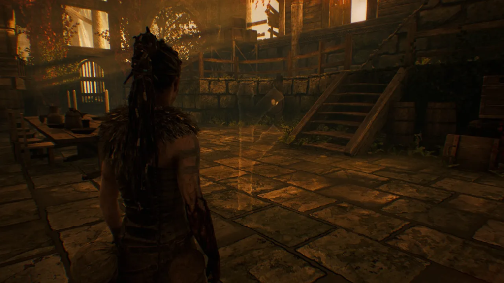 Senua stands in ruined hall in Hellblade: Senua's Sacrifice