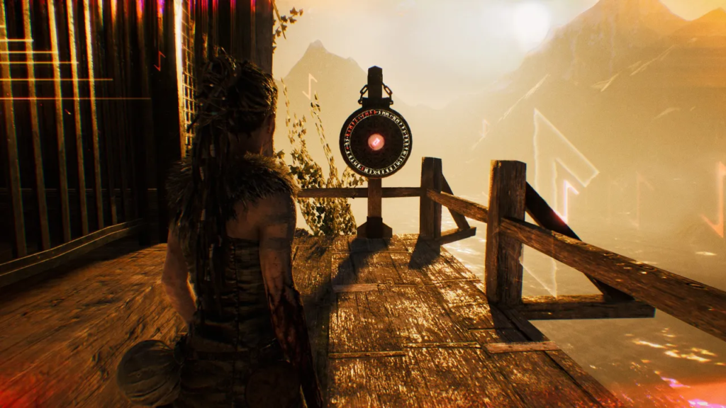 Senua in Hellblade stands on wooden platform near rune gate