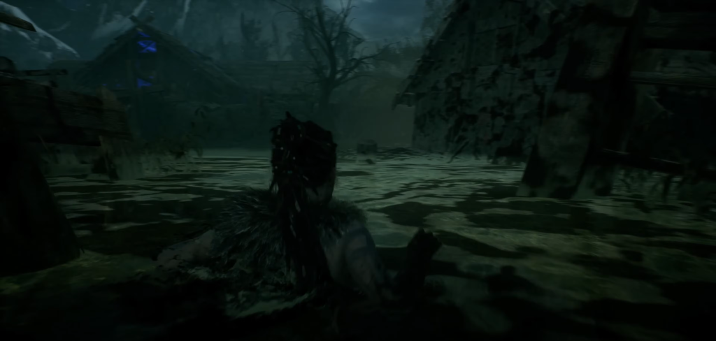 Person wades through flooded village at night