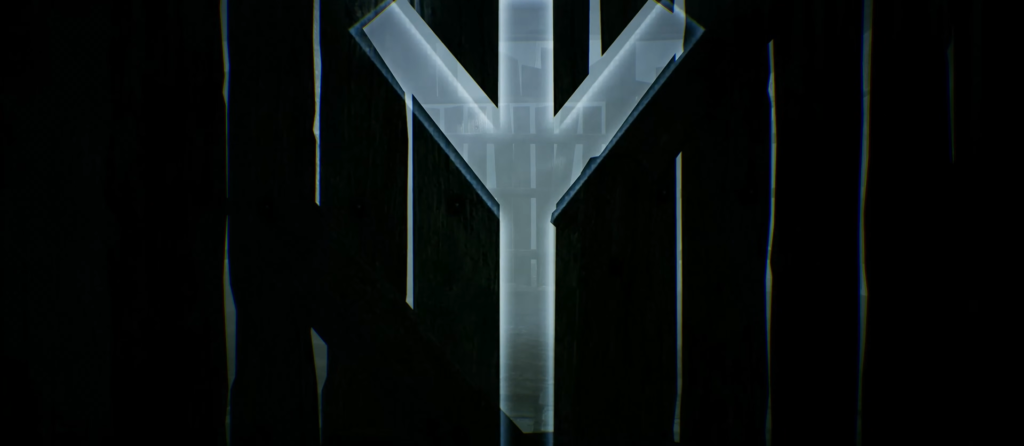 Gray Y-shaped symbol on black background