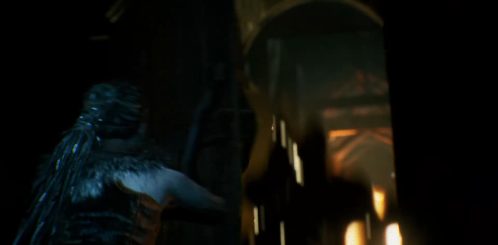 Blue armored figure crouching in dark corridor