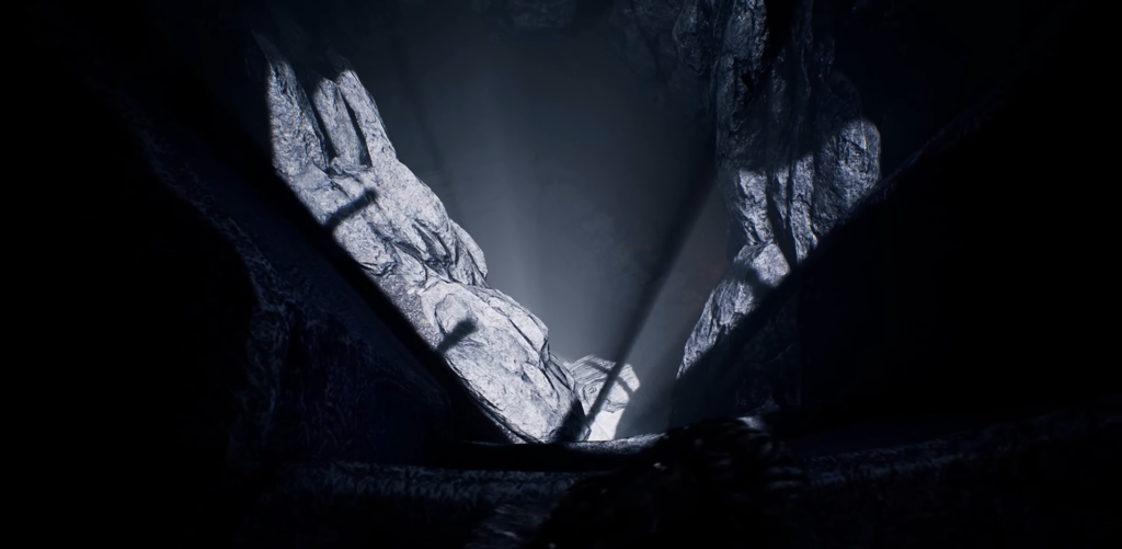 Light beams shining through rocky cave opening