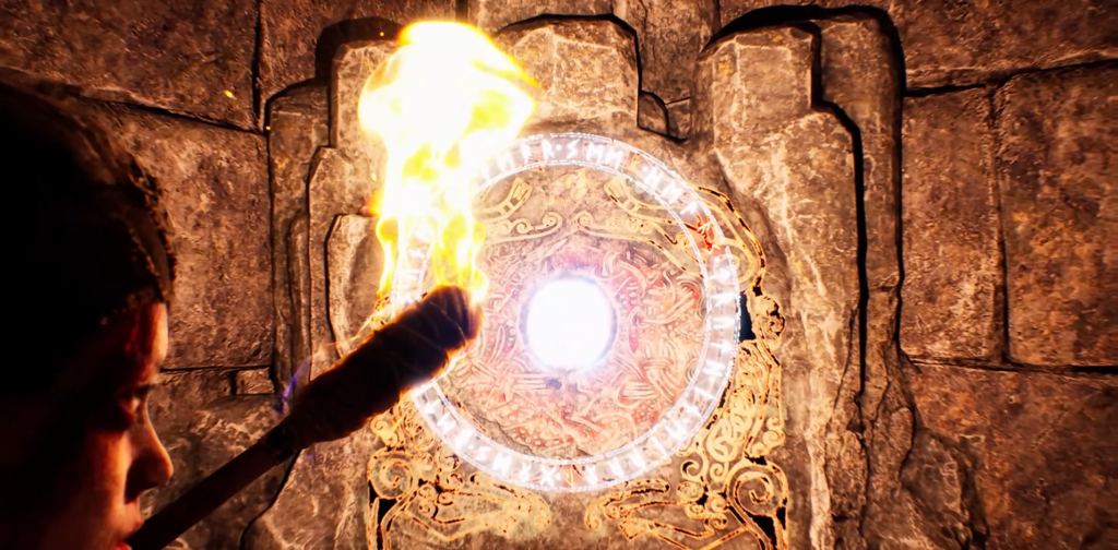 Person holding torch near glowing rune stone wall