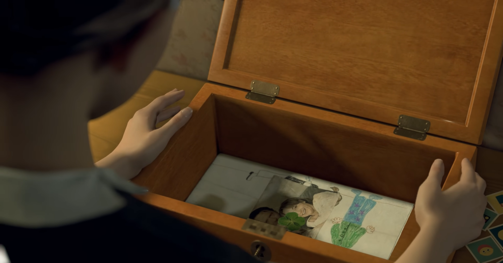Person opening wooden box with drawings inside