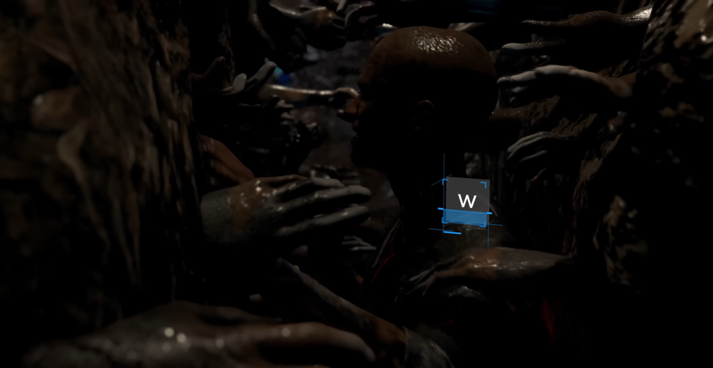 Bald man surrounded by hands in dark cave