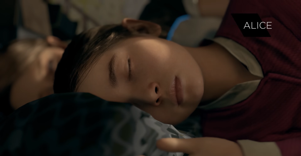 Alice sleeping on pillow in dim room