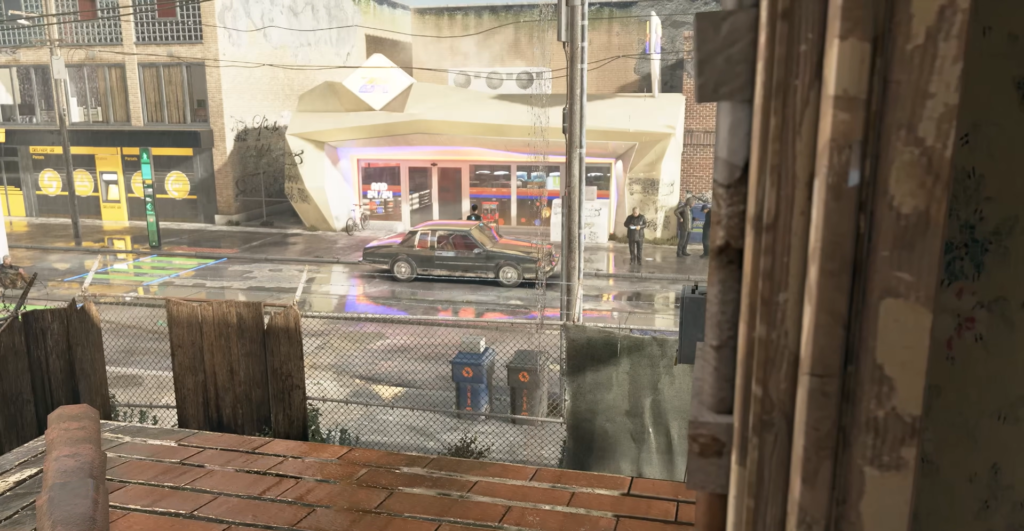 Car parked outside storefront on rainy city street