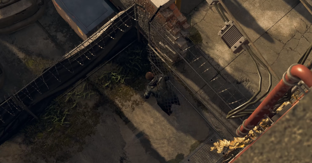 Person climbing chain-link fence in industrial yard