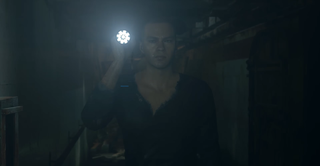Man holds flashlight in dark hallway