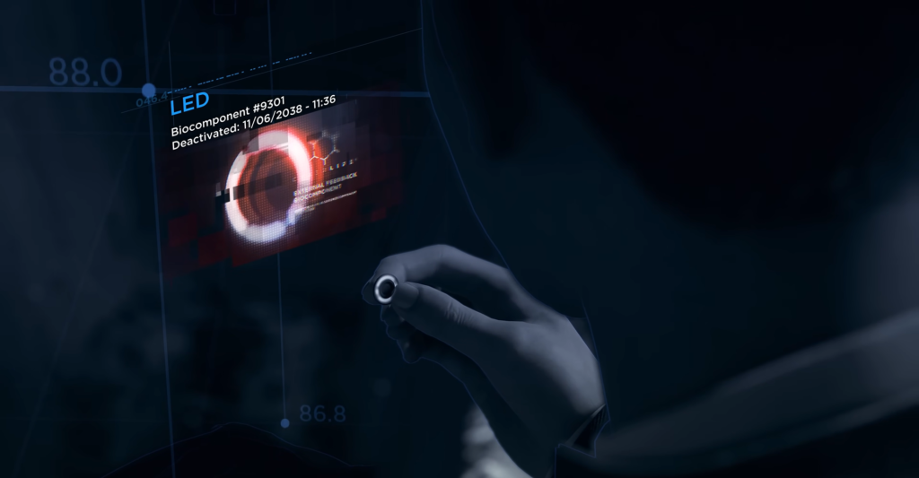 Hand holding small device beside blue holographic display