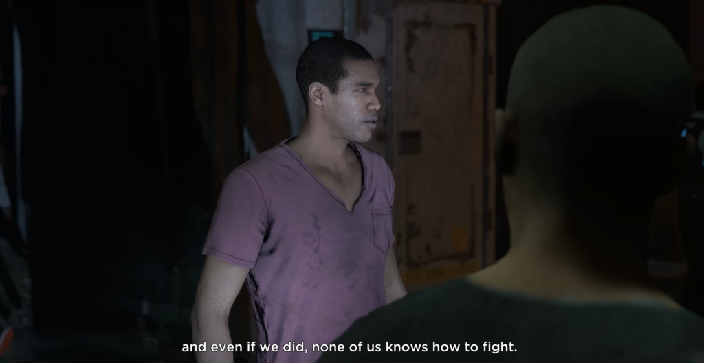 Man in purple shirt talking indoors