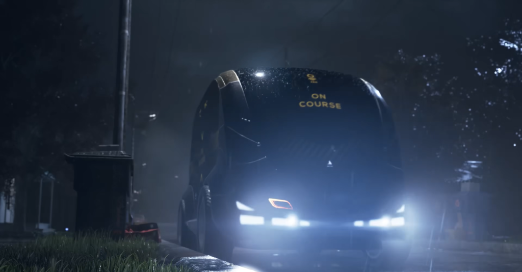 Black bus driving at night in rain