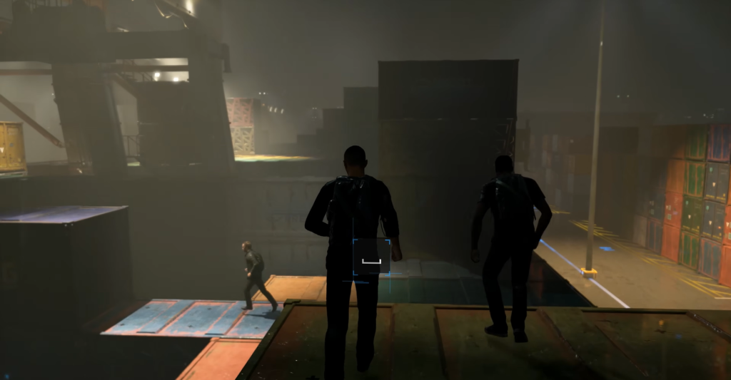 Two men running on shipping containers at night