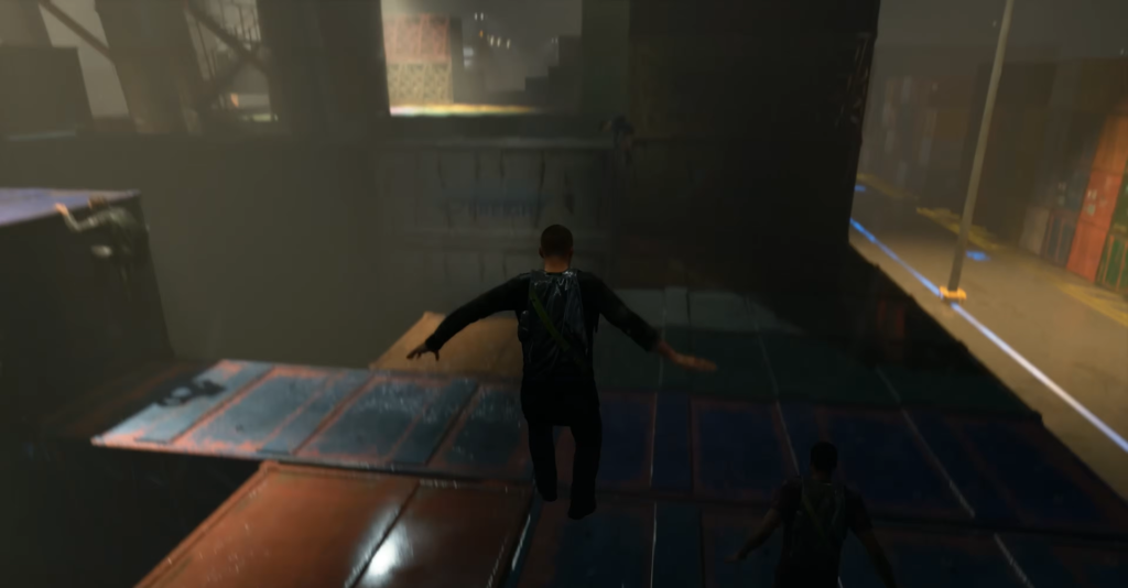 Person jumping across shipping containers at night dock