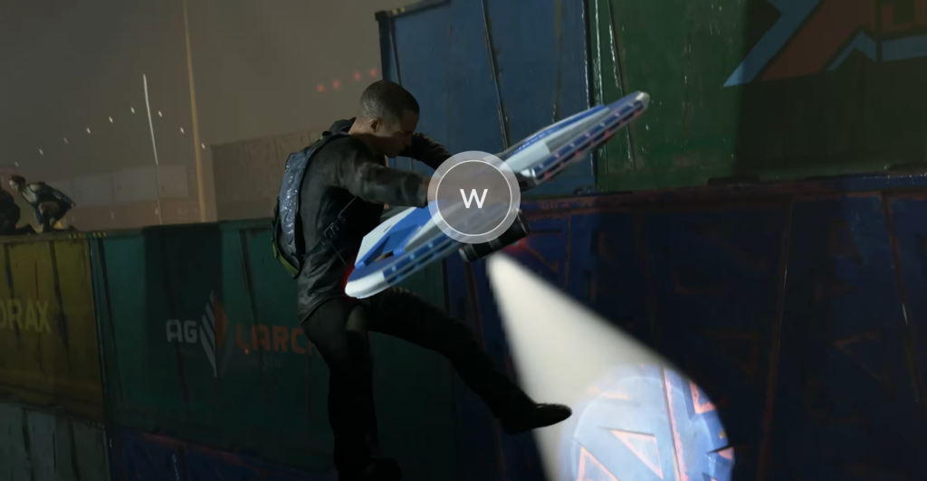 Man climbing shipping container wall at night
