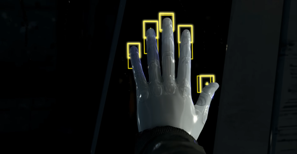 Gloved hand pressing scanner panel with yellow markers