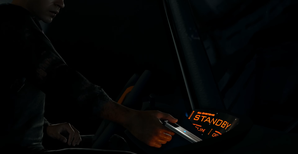 Person holding device near STANDBY display in cockpit