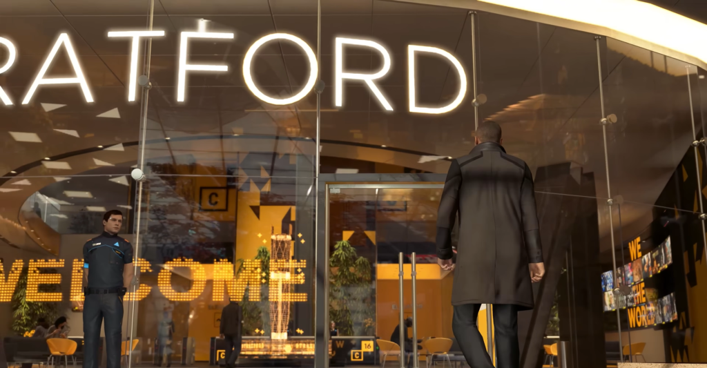Man walking into Stratford building entrance lobby