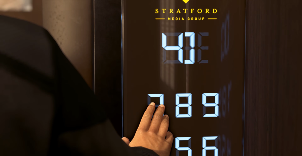 Hand pressing elevator button on digital panel