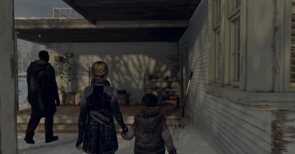 Adult and child holding hands on snowy porch