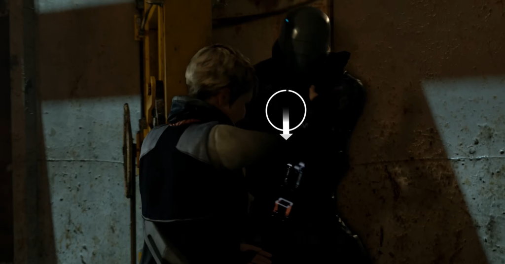 Person grapples black armored figure against metal wall