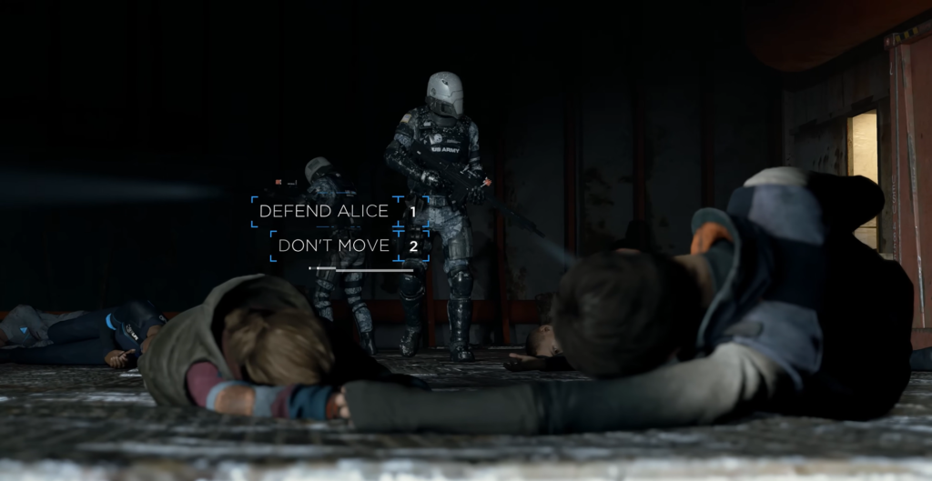 Armed soldiers stand over people lying on floor