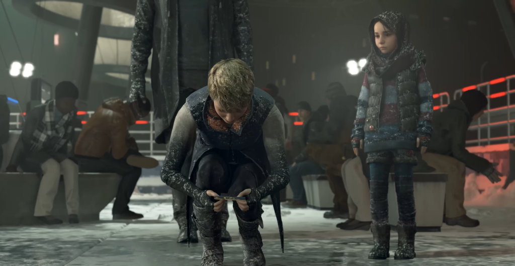 Boy holding device in snowy bus station waiting area