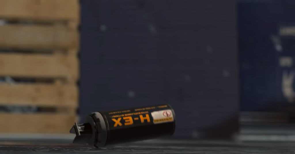 Black spray can lying on floor indoors