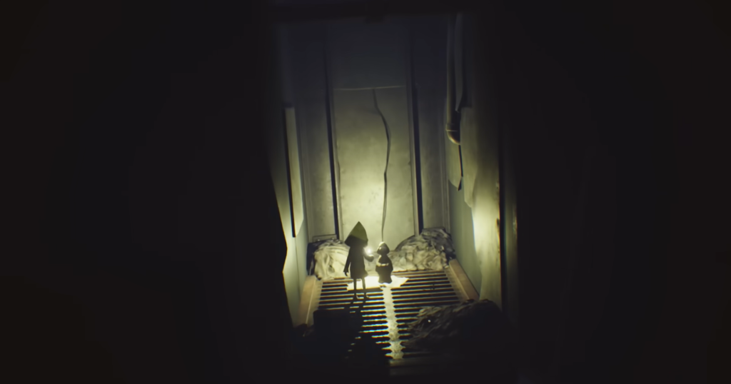 Little Nightmares characters standing on metal grate corridor