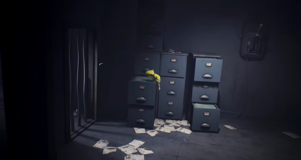 Six from Little Nightmares climbing filing cabinets in office