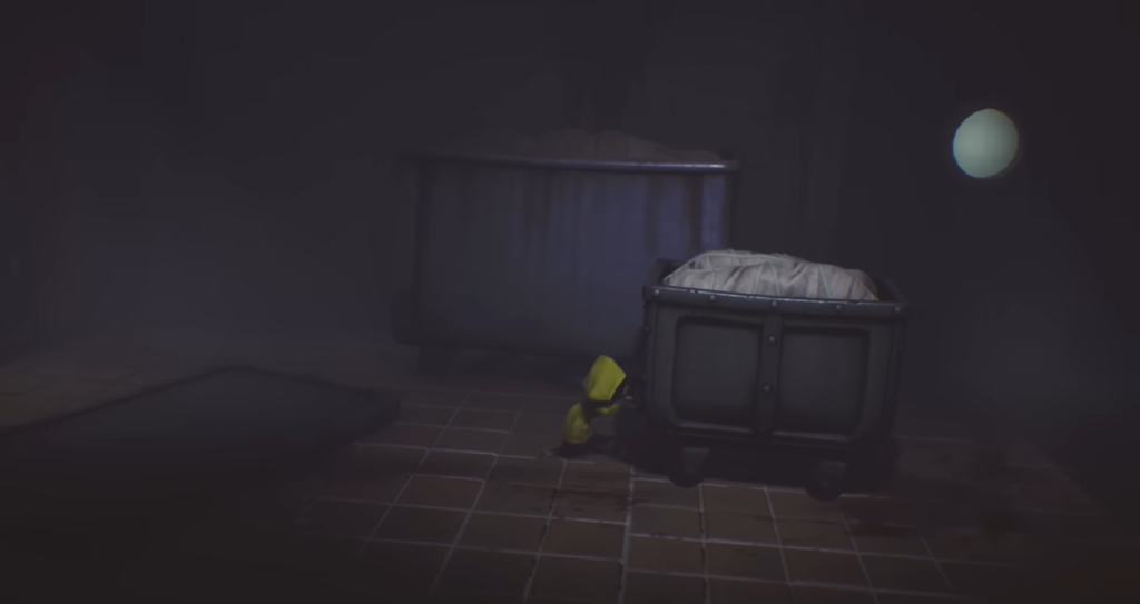 Six from Little Nightmares pushing cart in room