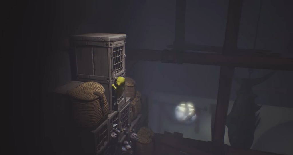 Six from Little Nightmares climbs stacked crates indoors
