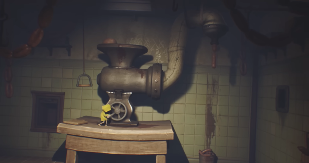 Six from Little Nightmares turning meat grinder in kitchen